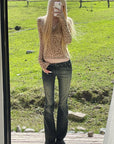Rase le sol Faded Flared Denim Pants with Copper-Tone Rivets & Embroidered Back Pockets