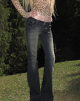Rase le sol Faded Flared Denim Pants with Copper-Tone Rivets & Embroidered Back Pockets