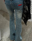 Rase le sol Distressed Low-Rise Flared Denim Pants
