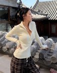Hydrae Fitted Half-Zip Knit Top with Thumbholes