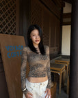Hydrae Leopard Print Long Sleeve Top With Fitted Silhouette And Lace Trim Details