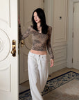 Hydrae Leopard Print Long Sleeve Top With Fitted Silhouette And Lace Trim Details