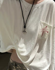 Rase le sol Amor Fati Cross-Embroidered Asymmetric Draped Long Sleeve Top