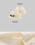 Rase le sol Cream Layered Ruffle Bubble Mini Skirt With Cross-Wing Appliqué