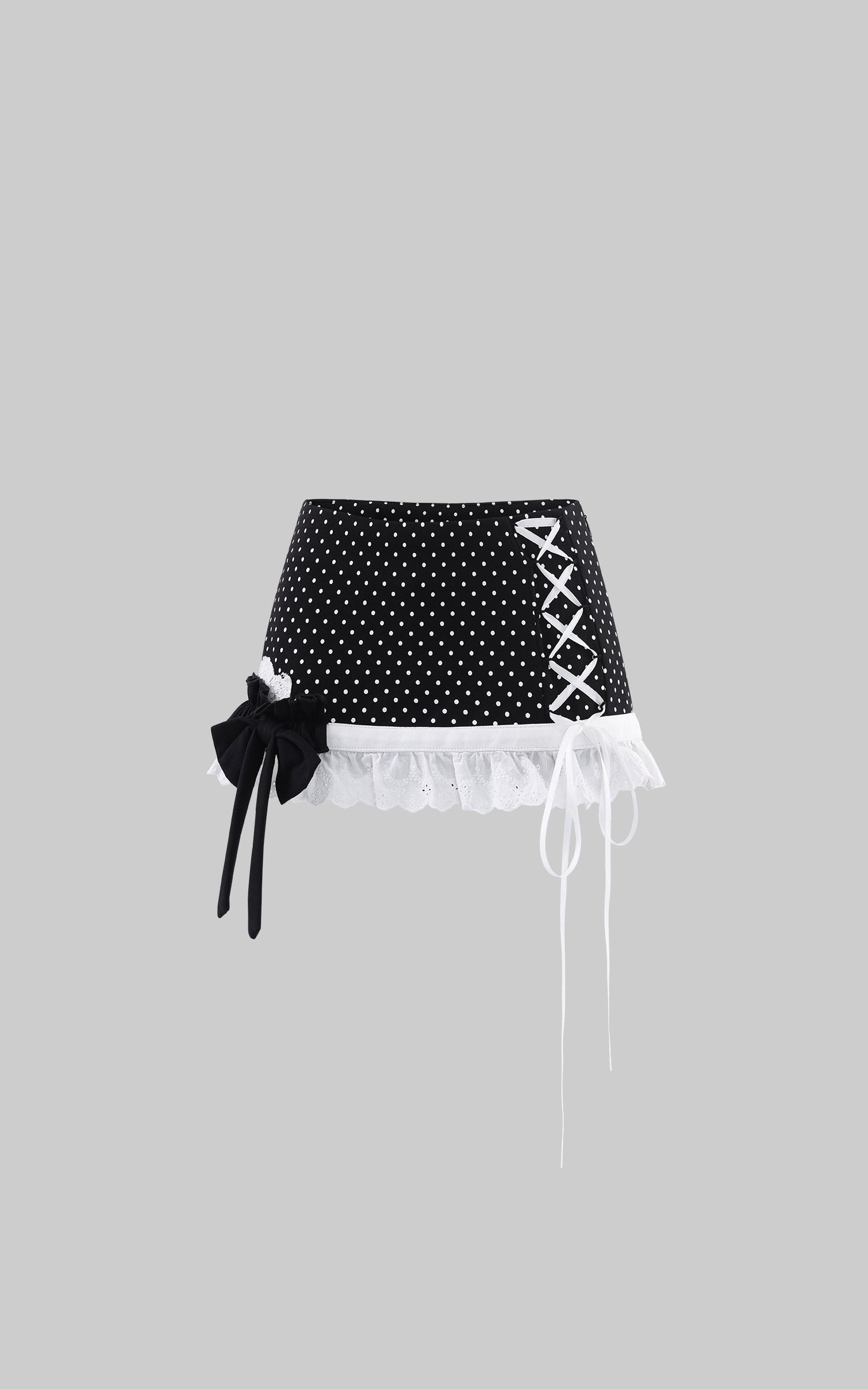WARDEN EDGE Polka Dot Lace Up Mini Skirt with Ruffled Hem and Asymmetric Layered Detail