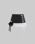 WARDEN EDGE Polka Dot Lace Up Mini Skirt with Ruffled Hem and Asymmetric Layered Detail