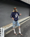 Rase le sol Low-Rise Asymmetric Waist Distressed Denim Pants
