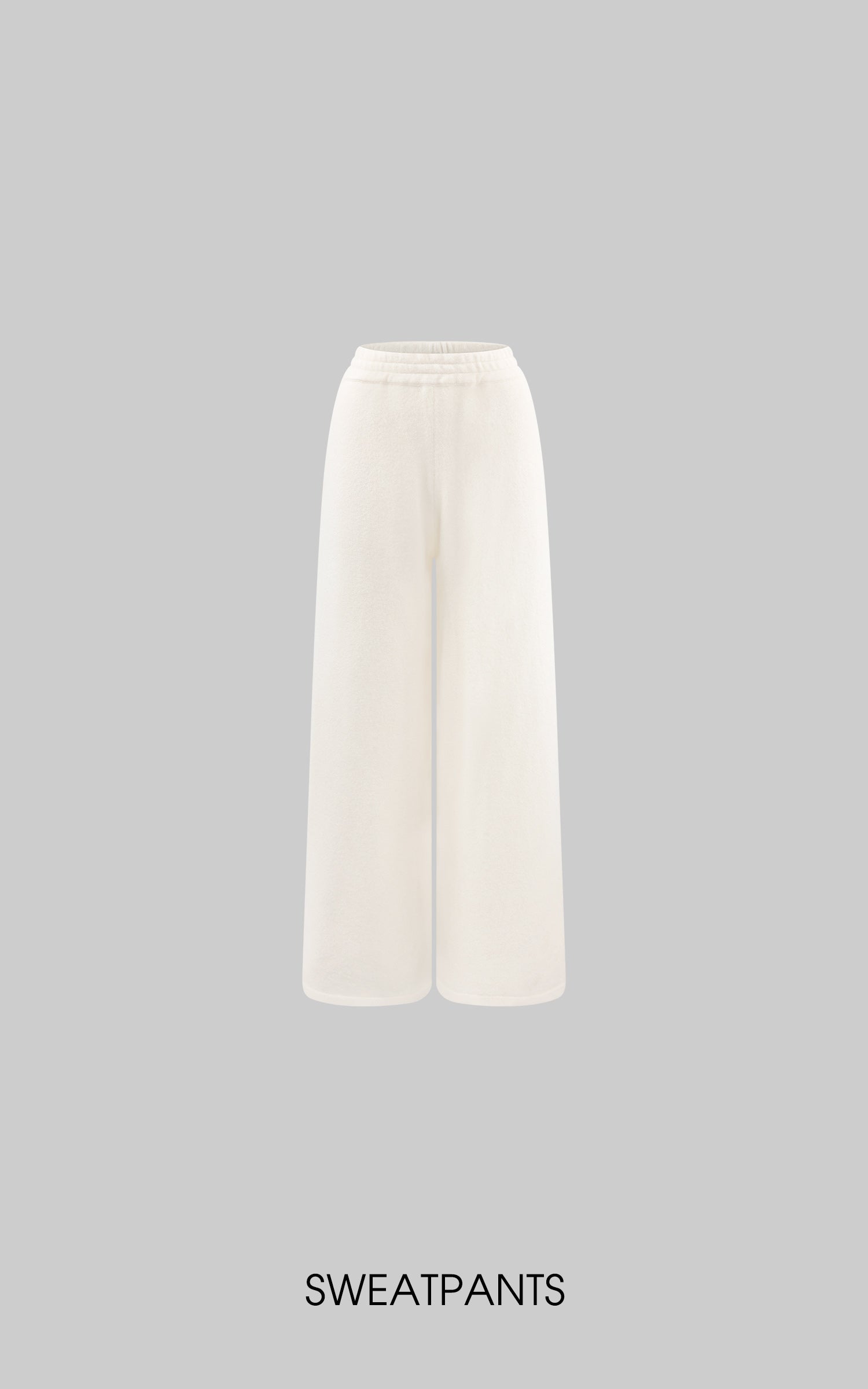 Ensemble minimaliste : gilet sans manches en maille et pantalon de survêtement large