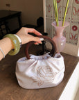 Hydrae Rhinestone Rose Satin Mini Handbag with Sculptural Wooden Ring Handles