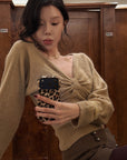 Hydrae Twist-Front Deep V-Neck Knit Top