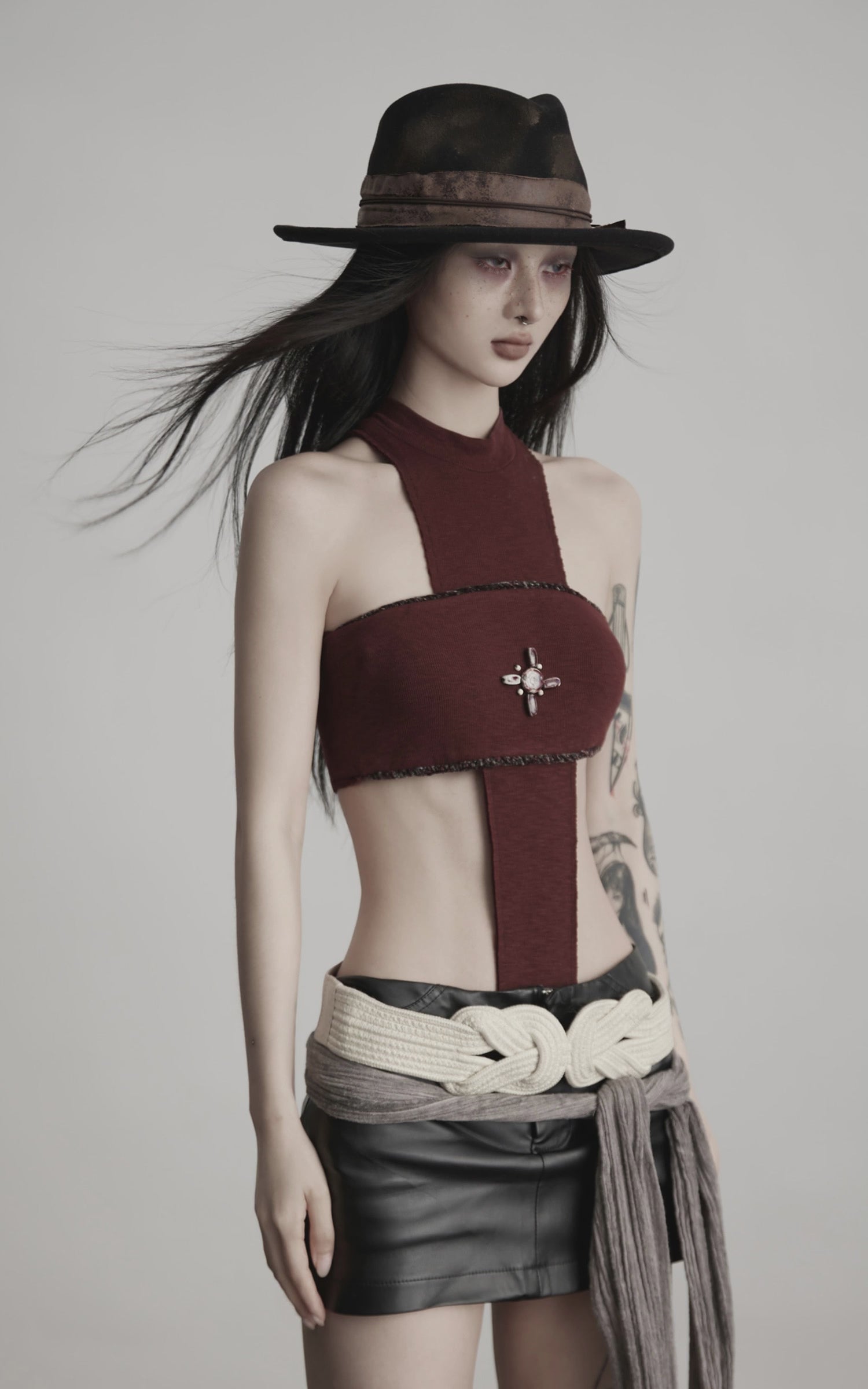 DOINDULGE Asymmetric Cutout Bodysuit with Ceramic Cross Embellishment
